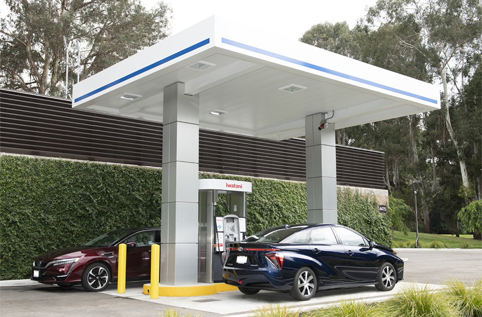 two cars on a fuel station